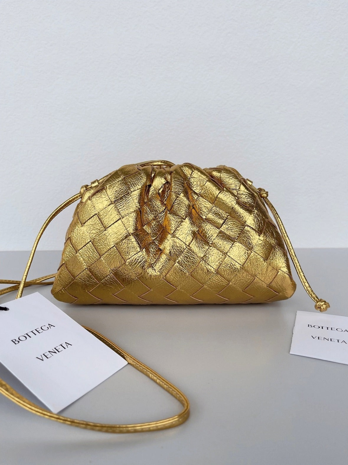 Boutique Quality || Bottega Veneta Mini Pouch with Strap Gold