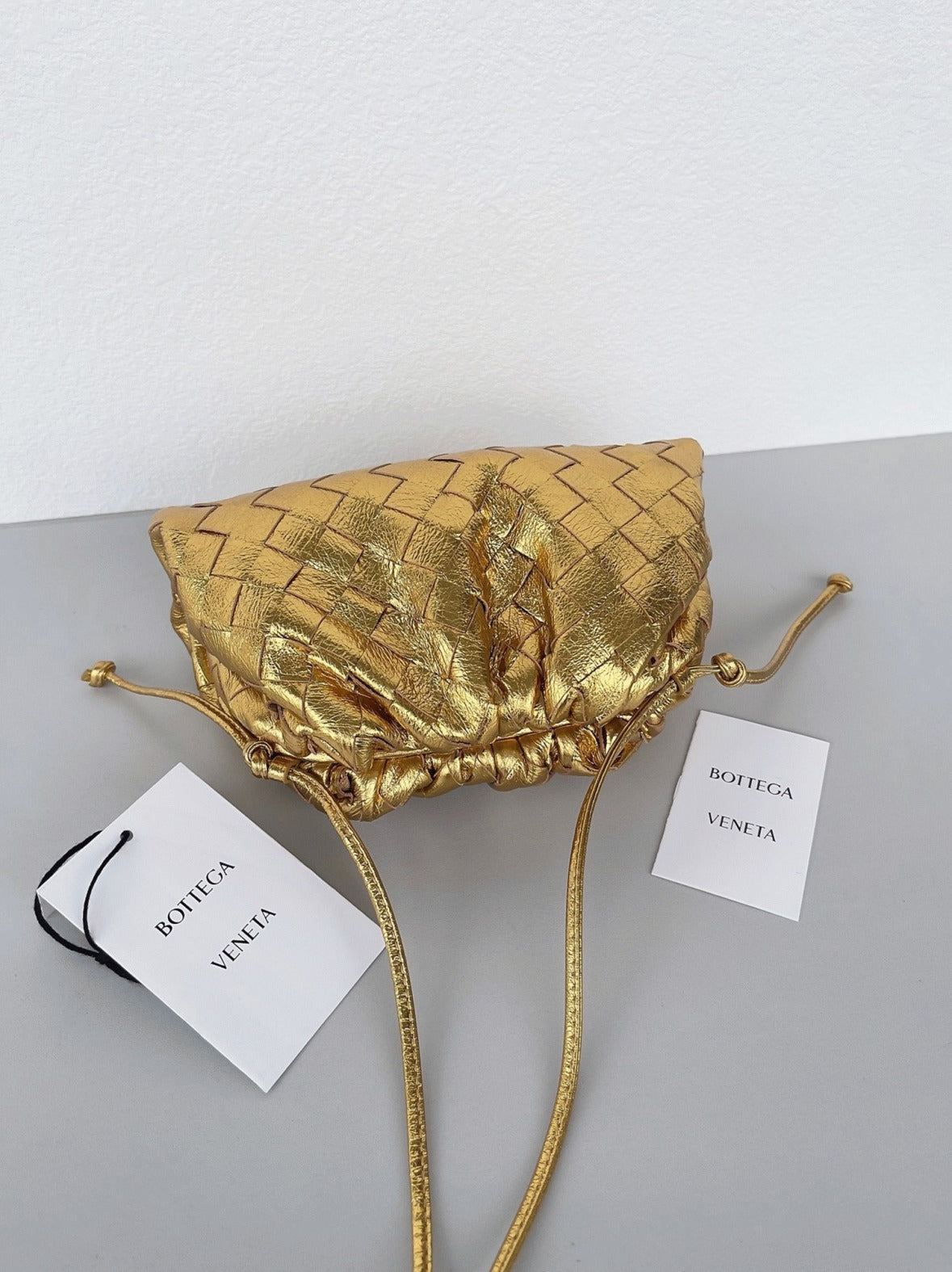 Boutique Quality || Bottega Veneta Mini Pouch with Strap Gold