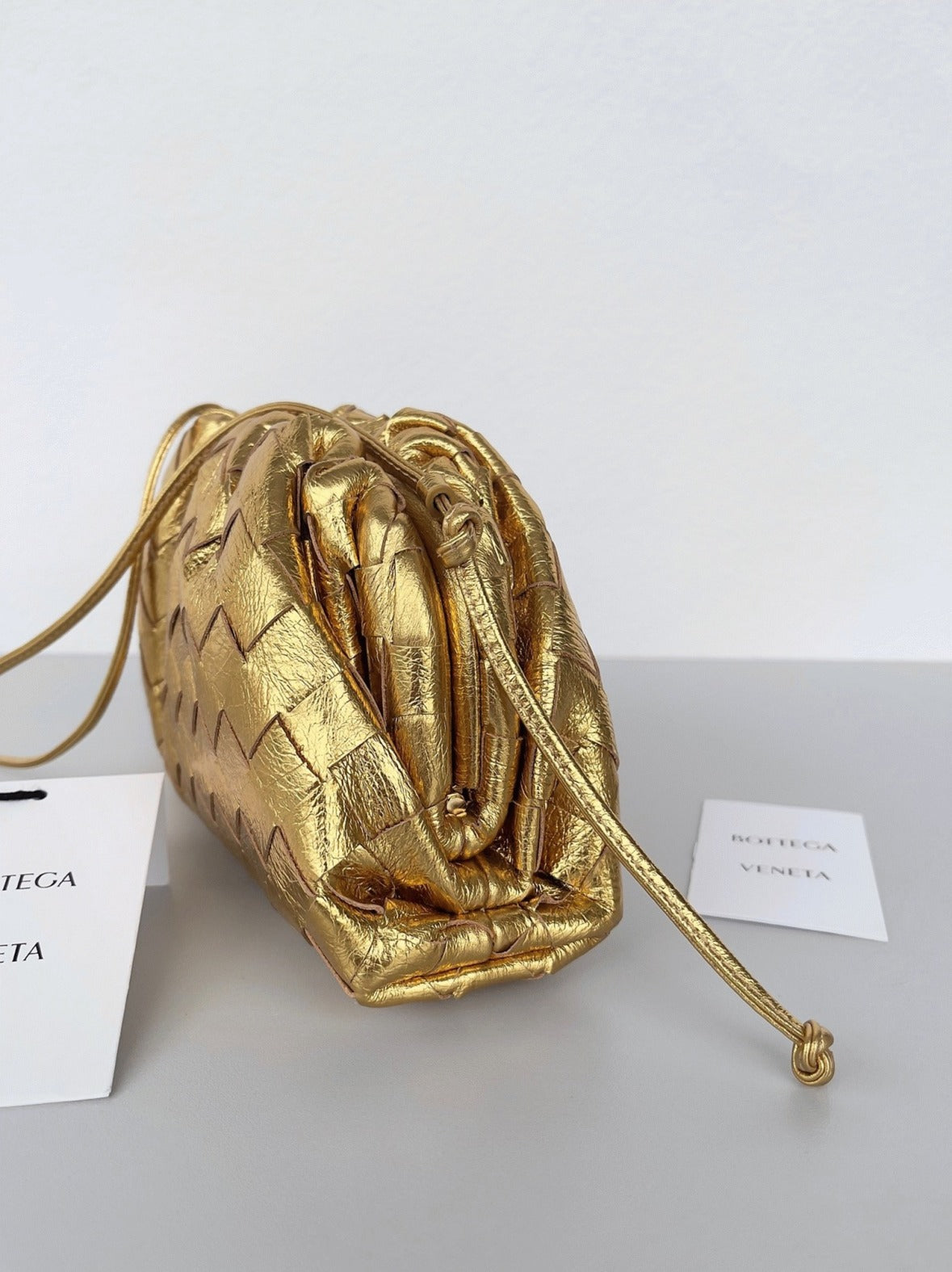 Boutique Quality || Bottega Veneta Mini Pouch with Strap Gold