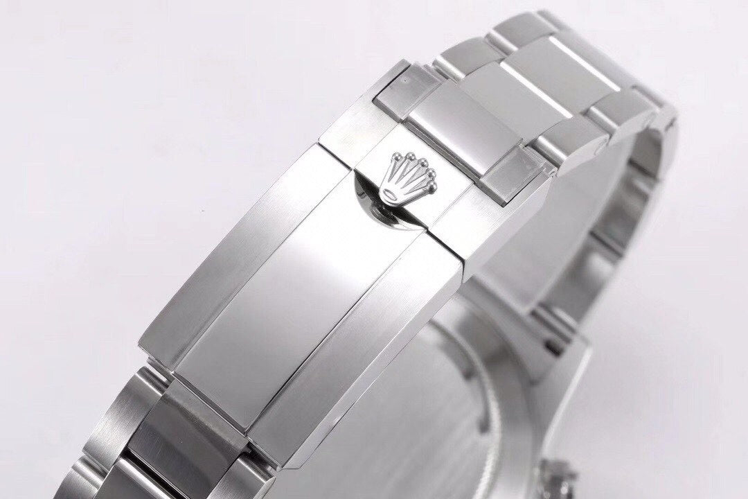 Rolex Cosmograph Daytona with a white dial and a green bezel