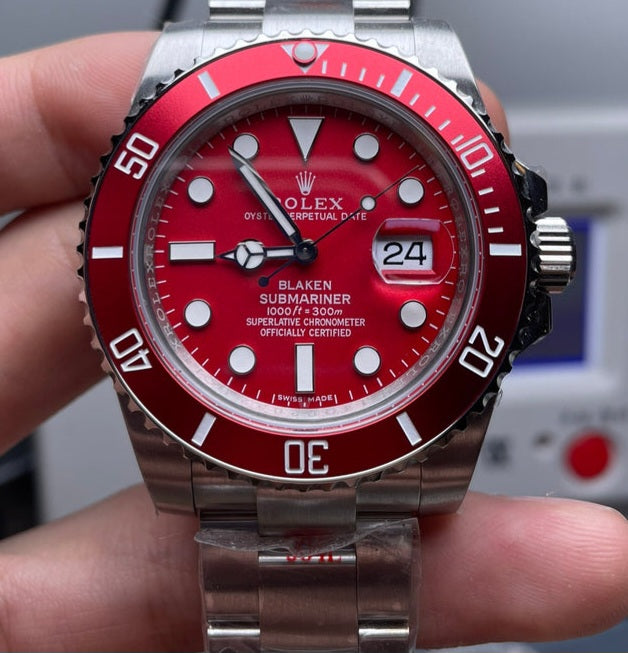 Rolex Submariner Date watch with a red dial and red bezel