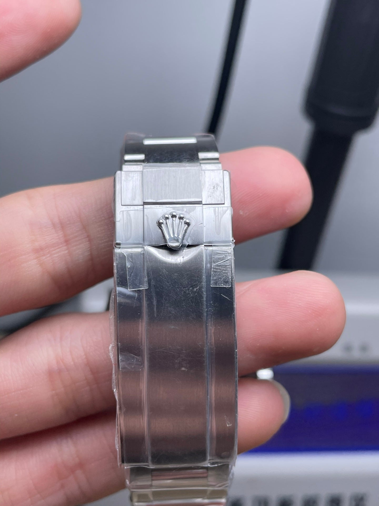 Rolex Submariner watch with an orange dial and bezel