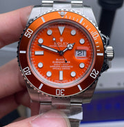 Rolex Submariner watch with an orange dial and bezel