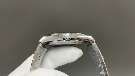 Rolex Land-Dweller watch with a silver dial and fluted bezel