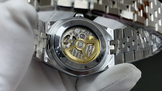 Rolex Land-Dweller watch with a silver dial and fluted bezel