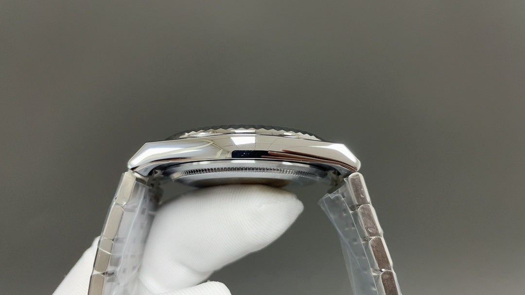 Rolex Land-Dweller watch with a silver dial and fluted bezel